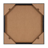 Back view of a square framed canvas with brown protective corner covers and a plain brown backing board secured by a slim black frame.