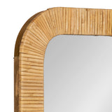 Corner detail of a rectangular wall mirror with a rounded rattan frame featuring evenly spaced vertical ridges in natural light brown tones.