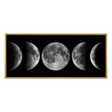 Framed canvas artwork displaying five detailed lunar phases from crescent to full moon on a black background with a light wood frame.
