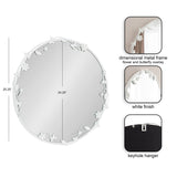 Round wall mirror with a white metal frame featuring dimensional flowers and butterflies overlaying the edges, measuring approximately 25 by 24 inches.