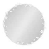 Round wall mirror with a white metal frame featuring delicate floral and leaf patterns wrapping around the edge.