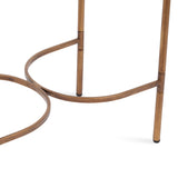 Curved metal legs and connecting supports of a side table, finished in warm brown with subtle joints and rubber feet on a white background.