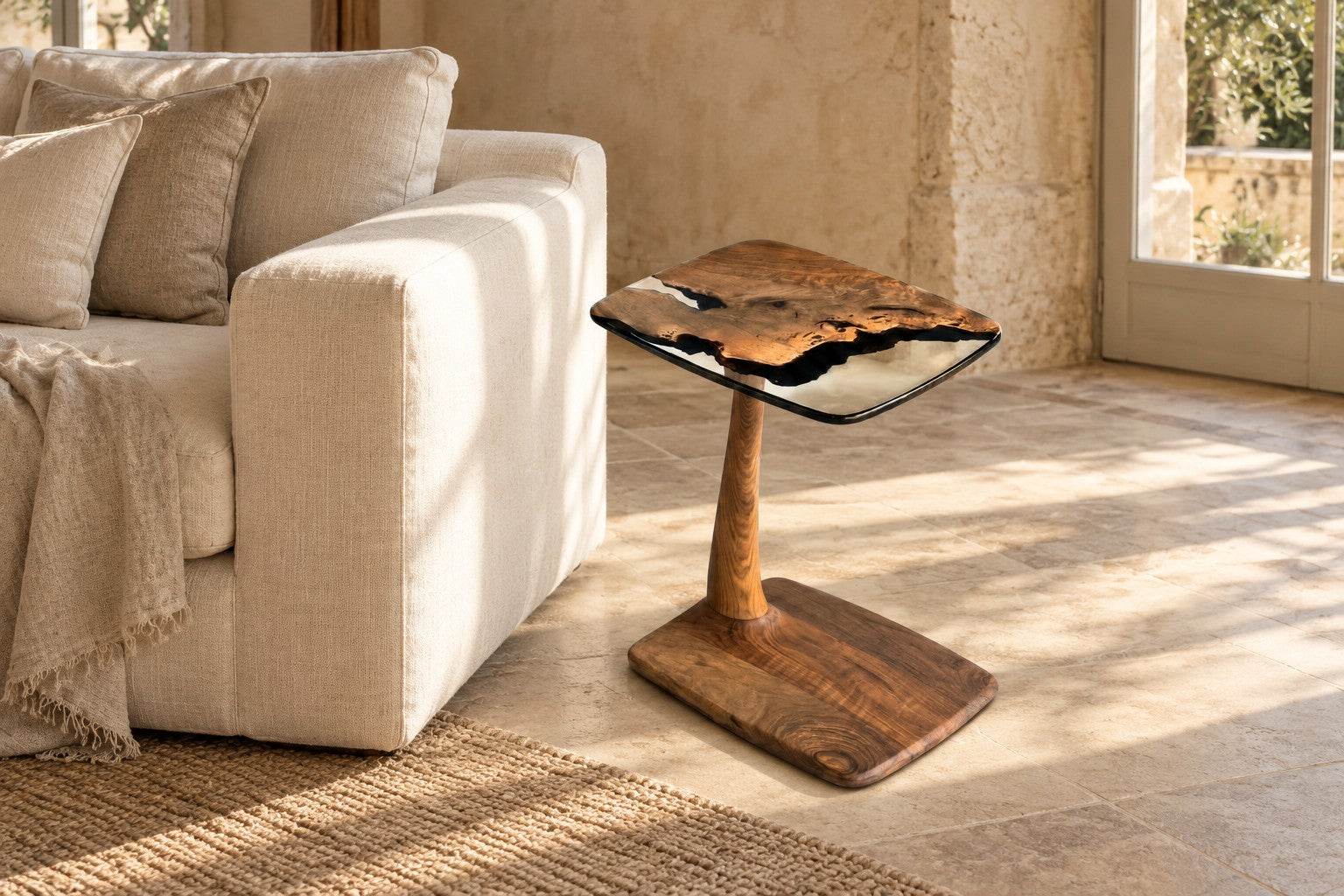 Walnut and clear resin Gizz side table styled beside a linen sofa in a warm stone interior